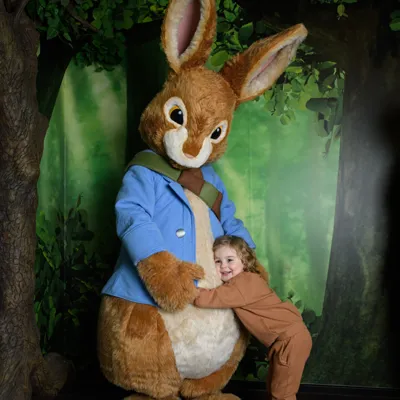 Child hugging Peter Rabbit at Peter Rabbit: Explore and Play attraction Blackpool