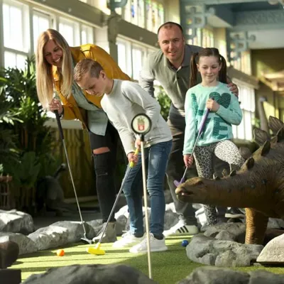 Family Playing Mini Golf at Dino Mini Golf at the Blackpool Tower