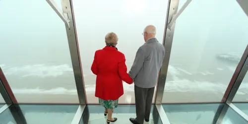 Couple looking at the view on top of the Blackpool Tower Eye
