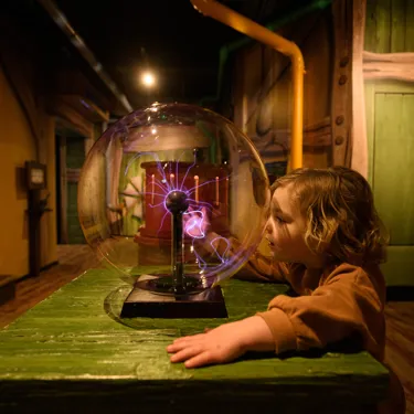Toddler at the Invention Workshop at Peter Rabbit Explore and Play attraction, Blackpool